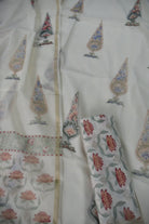 Traditional outfit with floral patterns on a white background