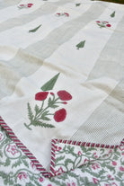 Embroidered fabric with floral patterns on a white background