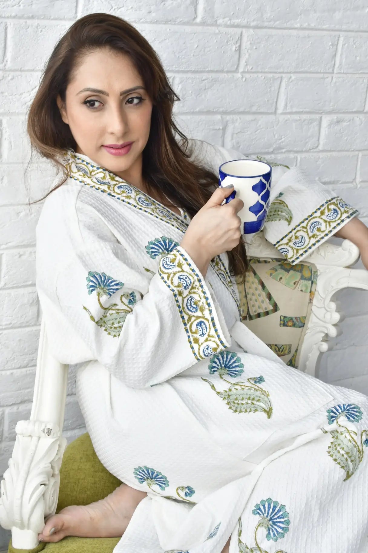 Woman in beautiful luxurious bathrobe