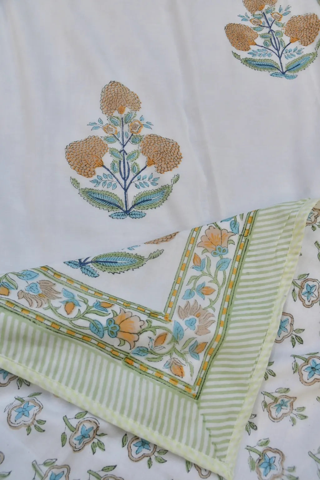 Embroidered fabric with floral patterns on a white background