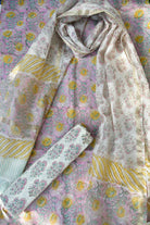 Floral patterned fabric with pink and yellow colors on a textured surface.