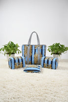 Decorative blue and gold striped fabric on a bed