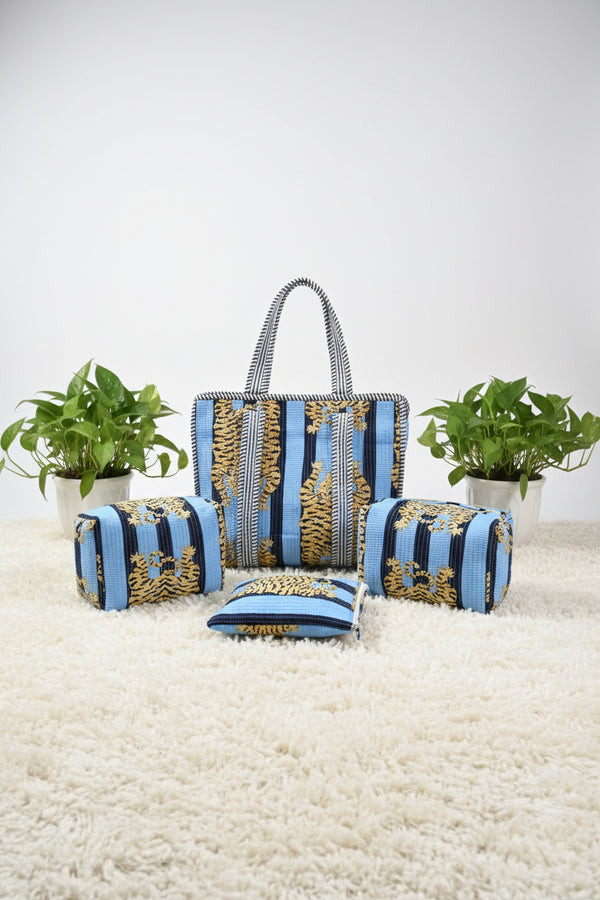 Decorative blue and gold striped fabric on a bed