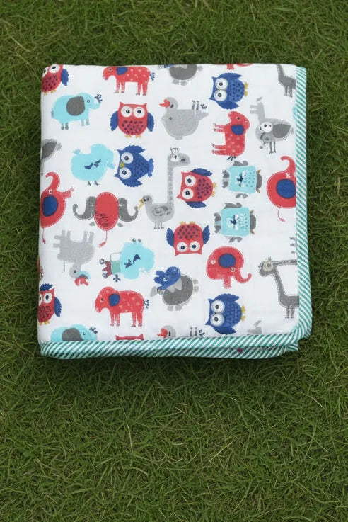 Folded dohar with animal pattern on a grassy background