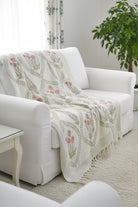 Peach throw on white sofa