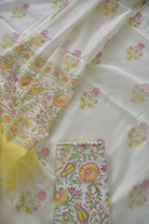 Floral patterned fabric with a yellow and white striped fabric swatch.